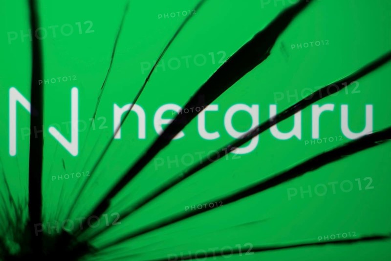 Netguru logo is visible on the broekn glass. Netguru is a Polish software development company.