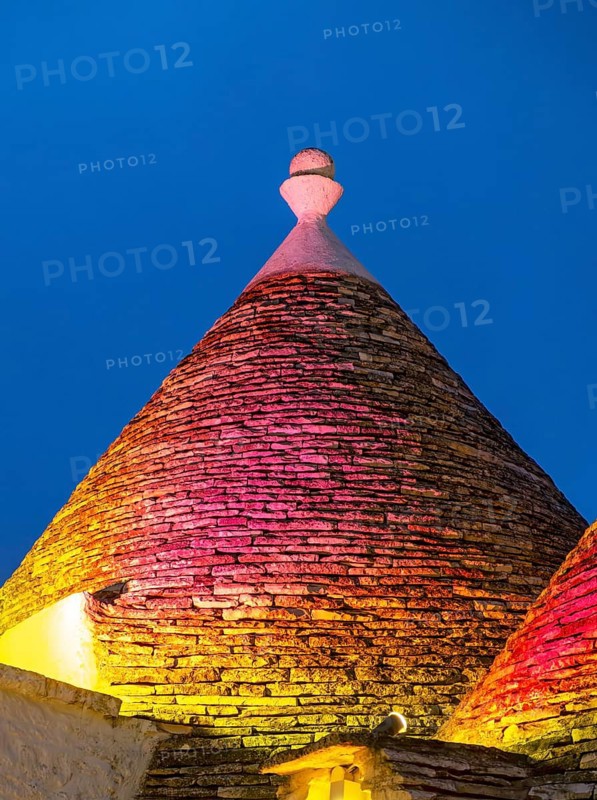 Close-up of illuminated Conical Trullo Roof, Alberobello Trulli District, Puglia, Italy