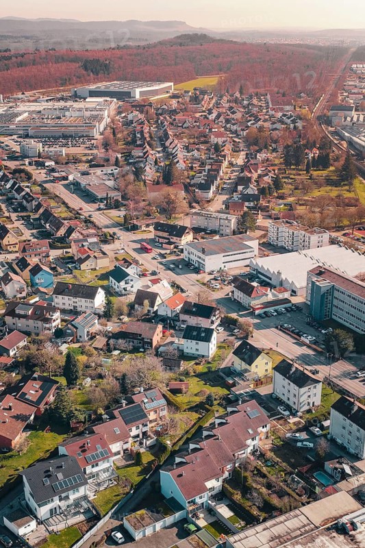 Aerial view of a sprawling suburban residential area with lots of greenery, Mühlacker, Enzkreis, Germany