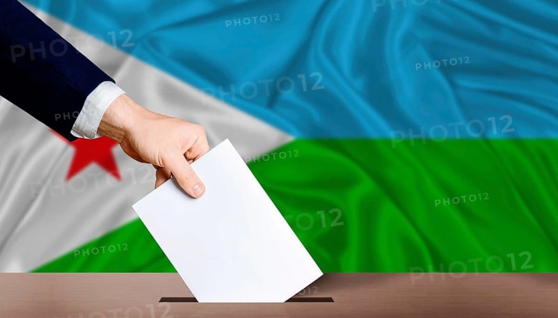 Djibouti Presidential vote 2026. Hand placing a ballot in ballot box with the Djiboutian flag in the background