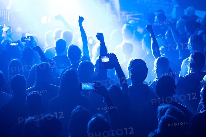 Crowd of people in front of the stage during the concert