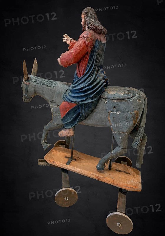Christ on the palm donkey, on a dark background, wooden figure from around 1400, Museum Bezau, Vorarlberg, Austria