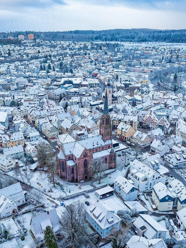 Aerial view of a wintry town with central church and snow-covered houses, Nagold, Black Forest, Germany