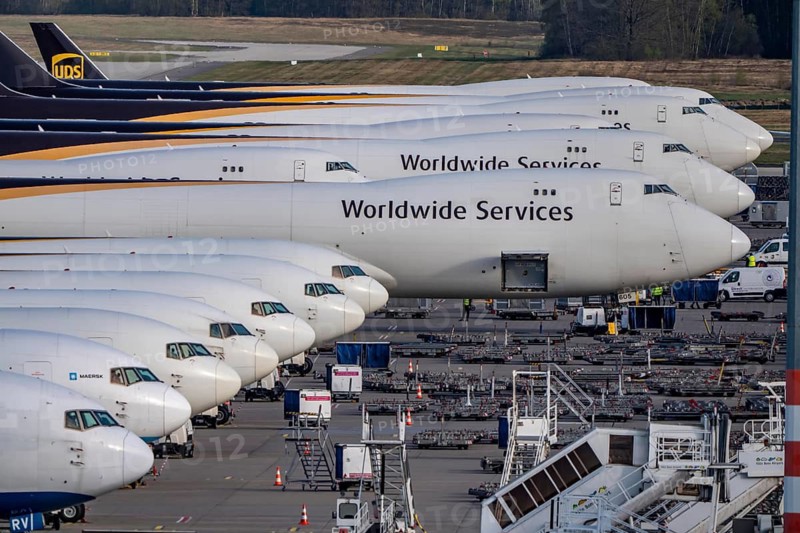 Cologne-Bonn airport, CGN, air freight center, UPS logisic hub, UPS cargo aircraft on the apron, at the logistics center, Boeing 747 freighter in the back