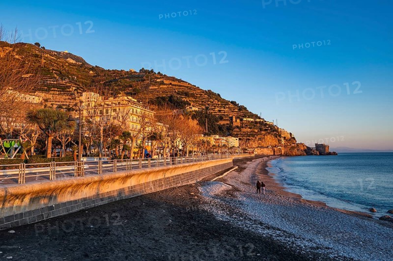 View of Amalfi town with blue sea during sunset on Amalfi Coast in Campania, Italy