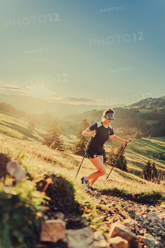 Summer trail running and hiking in the Alps on the Riedberg Pass between Obermaiselstein and Balderschwang in the Allgäu, Bavaria, Germany