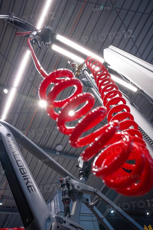 Red spiral cord in a modern illuminated bicycle workshop, Waldbike Manufaktur, bicycle workshop, Calw, district of Calw, Black Forest, Germany