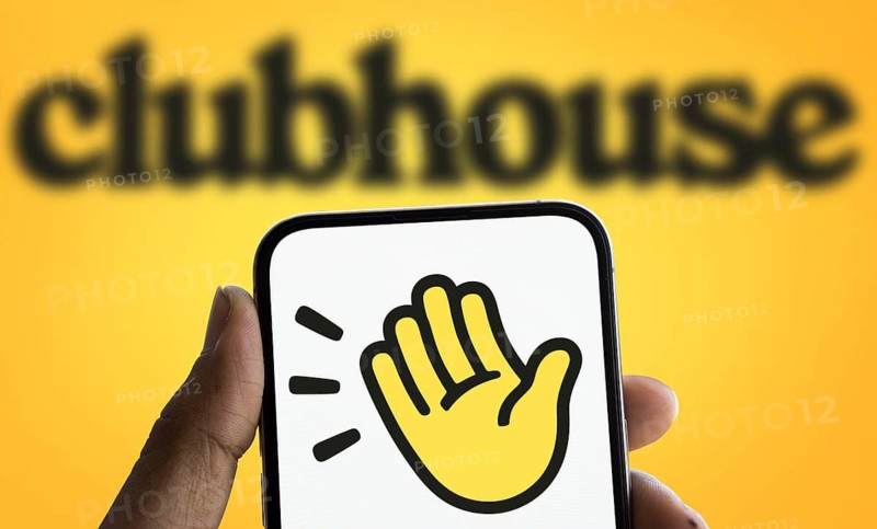 Clubhouse logo is displayed on smartphone. Clubhouse is a social audio app for iOS and Android.