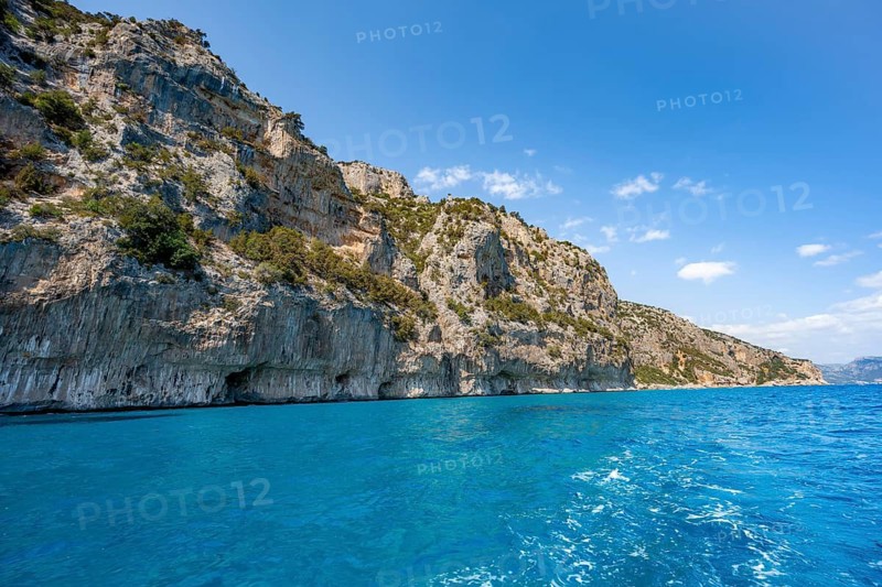 Picturesque rocky coast, cliffs and blue sea, Golfo di Orosei, Baunei, Sardinia, Italy