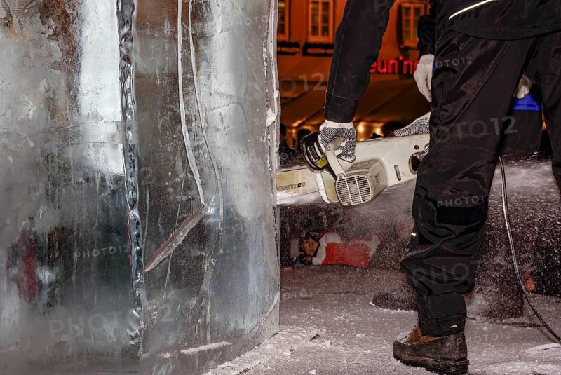 An ice sculpture is being created: ice carving street action as part of the long shopping night in the city center of Reutlingen, Baden-Württemberg, Germany, for editorial use only