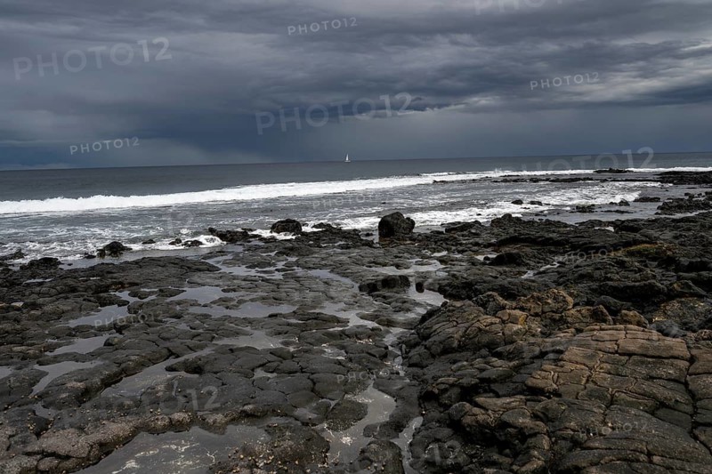 Rocky coast with volcanic stones, Playa de la Pequeña, Punta Usaje, Lanzarote, Canary Islands, Spain