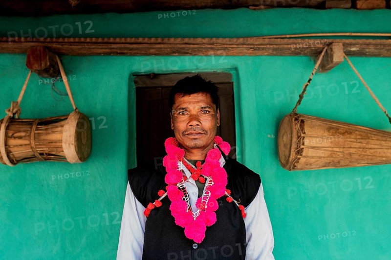 Portrait of a man from the Muria tribe, Bastar region, Chhattisgarh, India. He belongs to a tribal dance troup