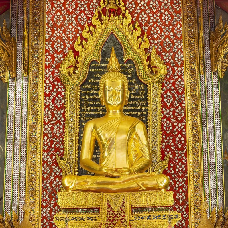Golden meditating Buddha surrounded by wall paintings with Buddhist teachings and representations of Buddha's disciples, Wat Makut Kasatriyaram Ratchaworavihan, Phra Nakhon District, Old Bangkok, Thailand