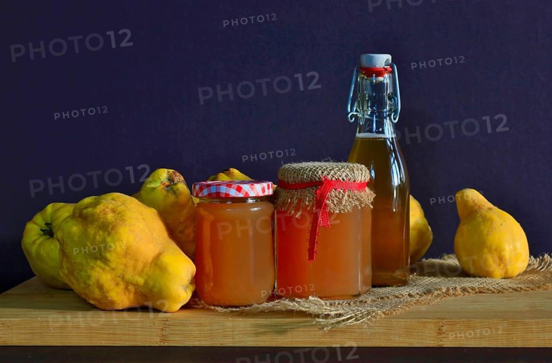 Still life with quinces, homemade quince jelly and quince liqueur, autumn, Germany