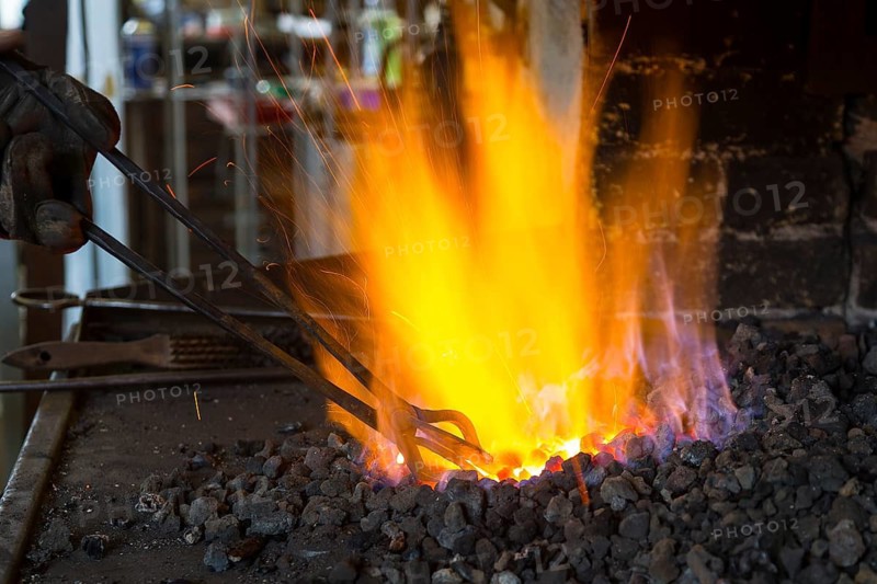 A blacksmith forging, working at the Ehnert forge in Dresden-Bühlau, Saxony, Germany