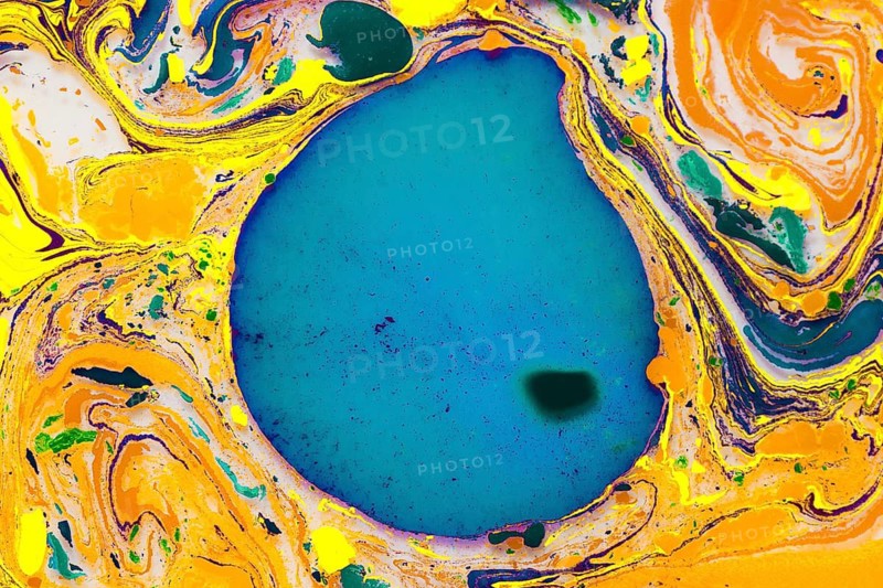 A dynamic abstract artwork featuring vibrant swirling colors of yellow, blue, green, and orange, shaping a large, central blue oval