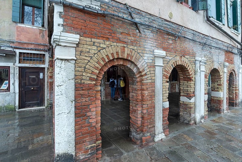 Historic arcades on Campo del Ghetto Nuovo, Venice, Veneto, Italy