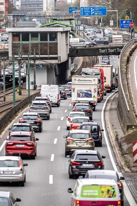 Everyday traffic jam on the A40 motorway, Ruhrschnellweg, in Essen, a good 5 km traffic jam heading east, Dortmund, near Essen city center, narrow lanes, two-lane, heavy traffic, commuters stuck in motorway traffic, North Rhine-Westphalia, Germany