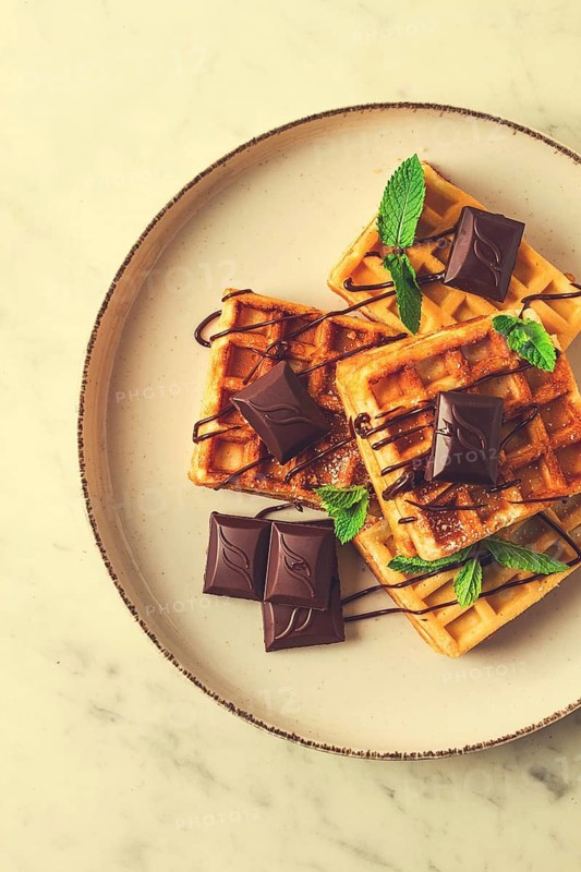 Viennese waffles, with chocolate, breakfast, on a beige background, no people, selective focus, waffles, dessert, chocolate, mint