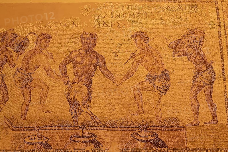 Mosaic depicting the pressing of grapes, ancient mosaic with several human figures in motion, accompanied by ancient text, Patras Archaeological Museum, Patras, Peloponnese, Greece