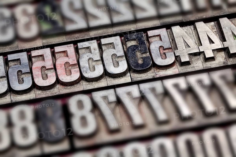 Hot metal printing setting, old letters made of lead for letterpress printing, Lettern aus dem Buchdruck, Bleisatz