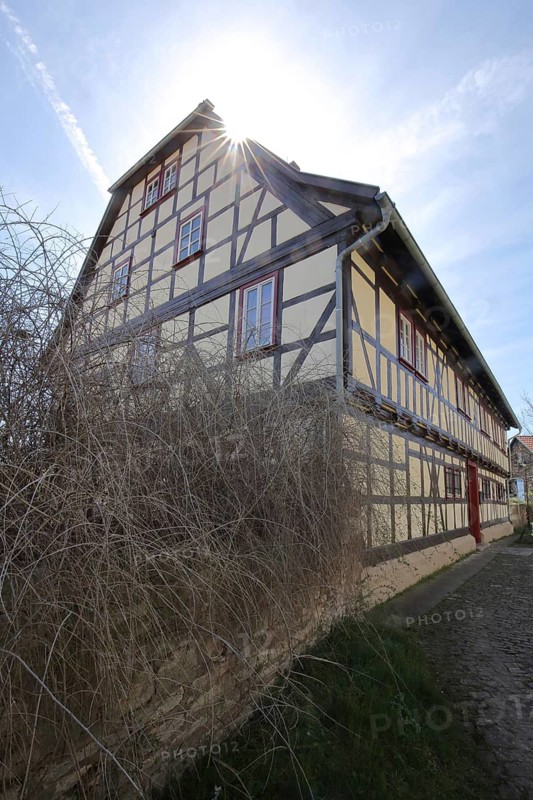 Rectory of St. Stephen in backlight, half-timbered house, Bad Langensalza, Thuringia, Germany