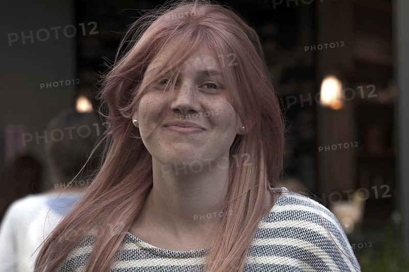 Smiling girl with freckles and waving hair, teenager, Freiburg, Baden-Württemberg, Germany
