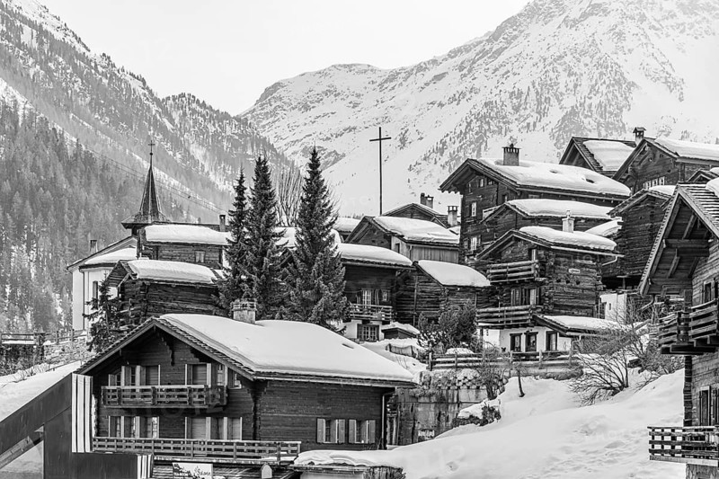 Snow-covered old farmhouses, large wooden cross, black and white photo, historic town center, Grimentz, Val d'Anniviers, Valais Alps, Canton of Valais, Switzerland
