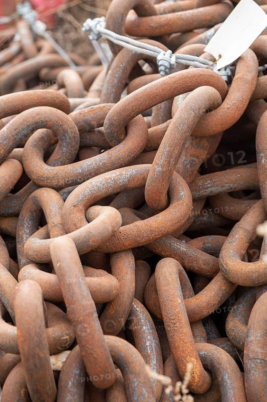 Detroit, Michigan - Heavy mooring chain at a U.S. Coast Guard station on the Detroit River, stored during winter. During the shipping season, the chains are used to anchor navigation buoys