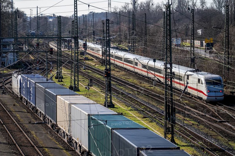 ICE long-distance train, on the line, container trains in the freight yard, so-called installation tracks in Duisburg-Rheinhausen, freight trains are parked here at short notice in front of continuing their journey, either to the trimodal terminal in Logport Duisburg or from there to distant destinations, such as China, as part of the new Silk Road, North Rhine-Westphalia, Germany