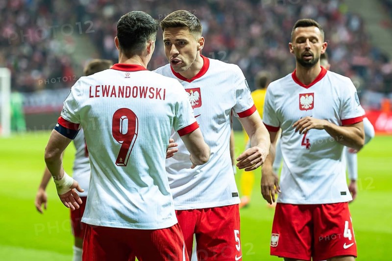 WARSAW, POLAND - MARCH 21, 2025: Qualifications for FIFA 2026. Match Poland - Lithuania 1:0. Robert Lewandowski and Jan Bednarek