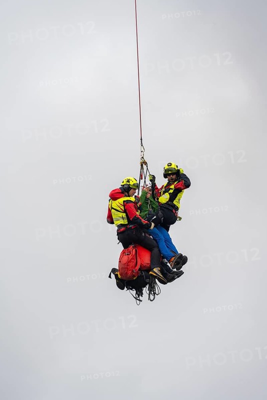 Air rescue operations in the mountains, rescue helicopter, Valais, Switzerland