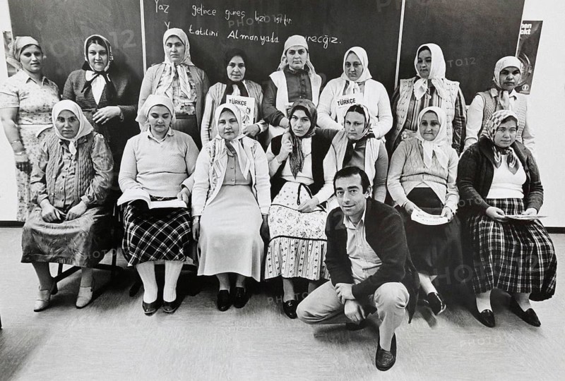 Group portrait of Turkish woman and their teacher in a literacy course, Gelsenkirchen, Germany