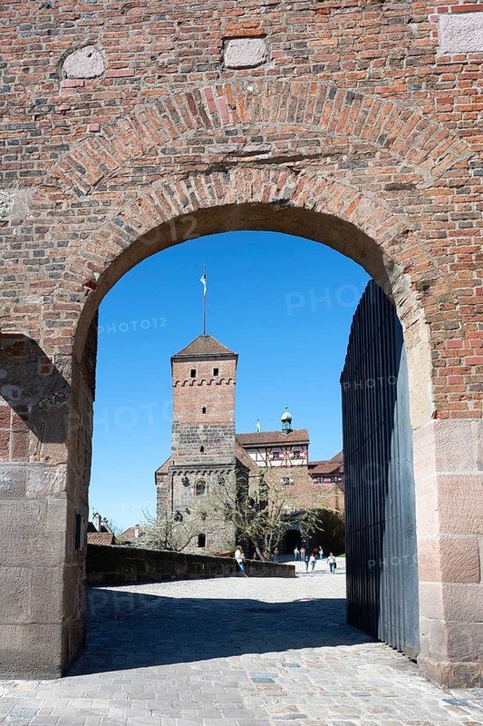 View through an archway to the Heidenturm der Kaiserburg in the old town of Nuremberg, Middle Franconia, Franconia, Bavaria, Germany