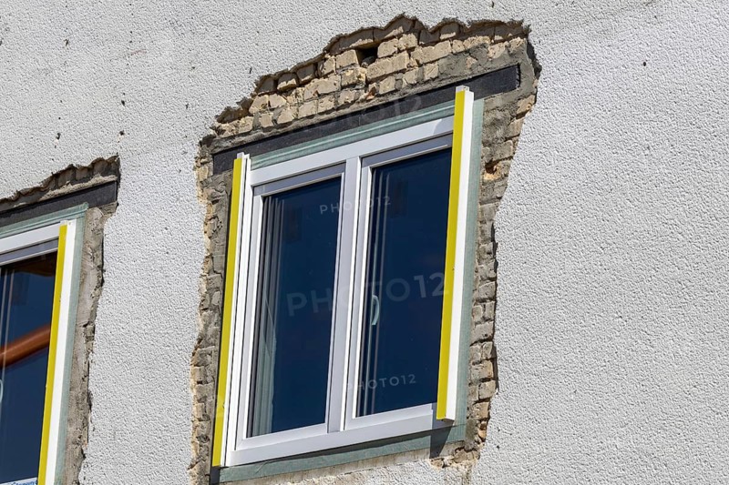 Newly installed window in an old building