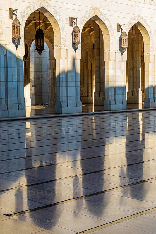Arched gates with brass lights at the Sultan Qaboos Mosque, Muscat, Arabian Peninsula, Sultanate of Oman