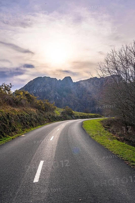 Beautiful road at sunrise in the mountains of Aiako Harria or Peñas de Aya, Guipúzcoa. Basque Country