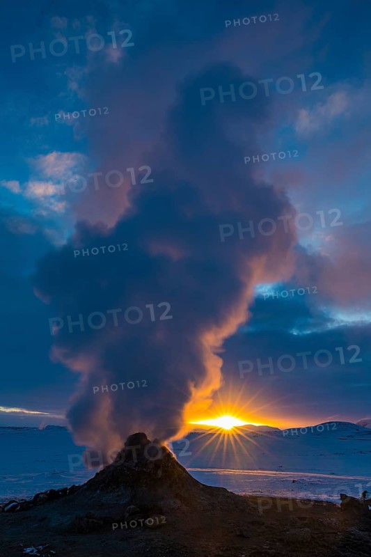 Mud pot with steam source at sunrise, Hverir solfataras field, fumaroles, snow-covered geothermal area, Northern Iceland Eyestra, Iceland