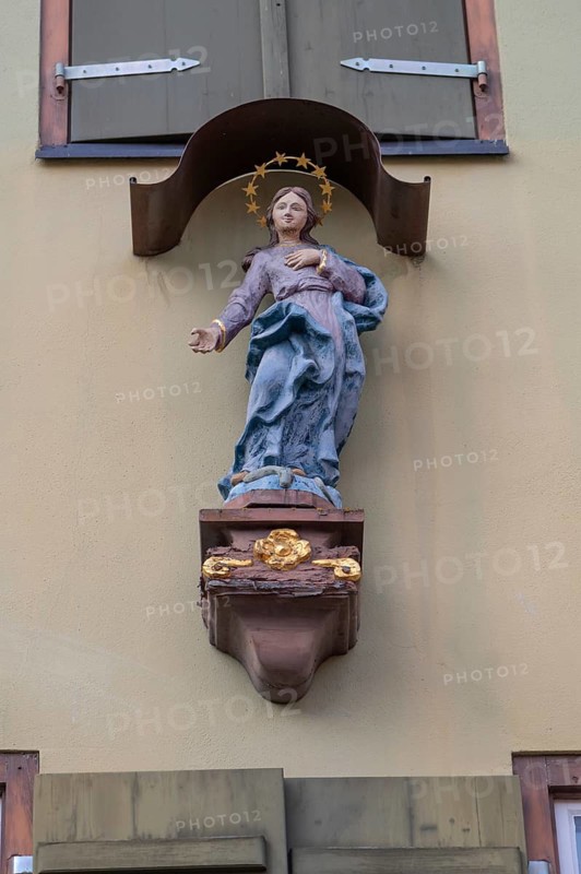 Figure of the Virgin Mary with canopy on a house, Dinkelsbühl, Bavaria, Germany