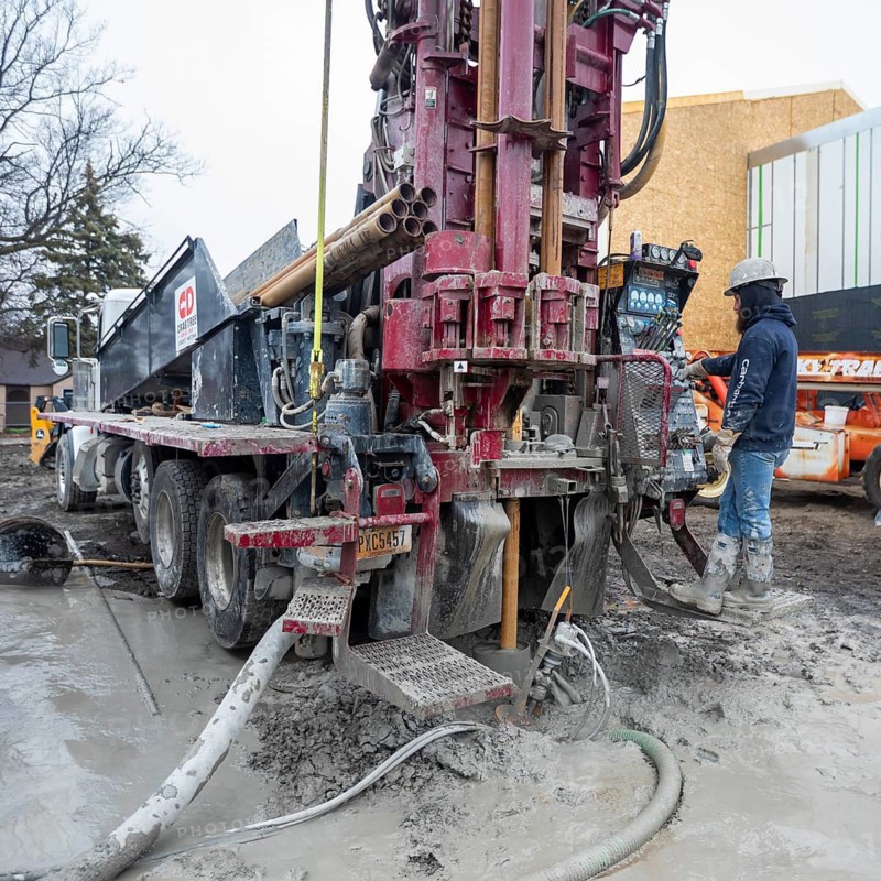 Detroit, Michigan - Workers for Crabtree Drilling drill a series of 500-foot deep wells for a geothermal system. The system will heat and cool a new commercial building housing a public market at the East Warren Development Corporation