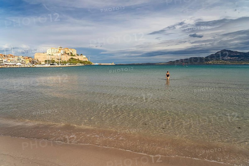The beach and city view with marina and citadel in Calvi, Balagne, Corsica, France
