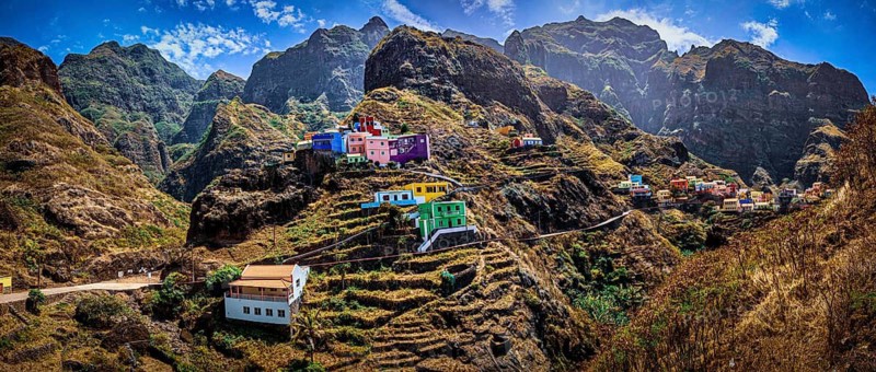 Panoramic view, small settlement, colorful village, picturesque nestled in raw, dramatic mountains under blue skies, spectacular hiking, natural heritage, cultural heritage, terraces in Fontainhas, Santo Antao, Cabo Verde, Cape Verde, Cape Verde, Cape Verde