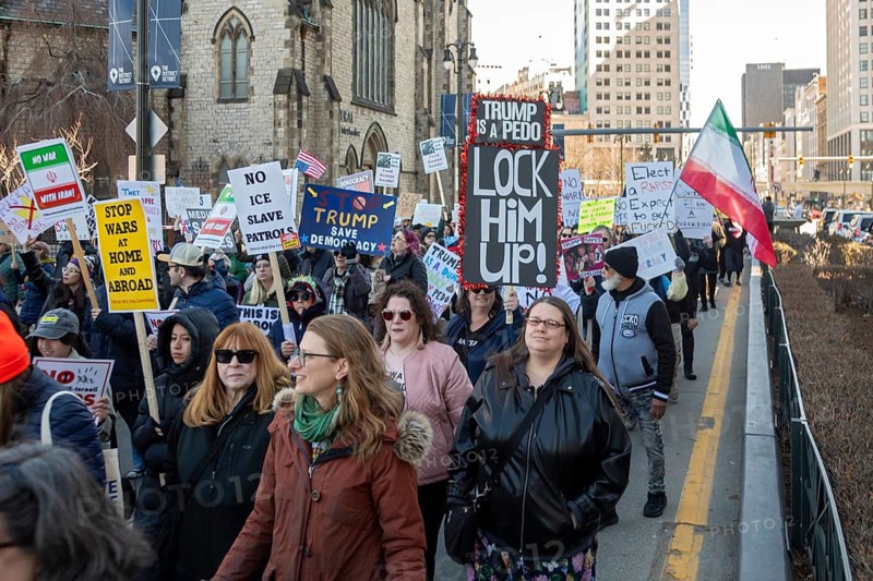 Detroit, Michigan USA - 28 March 2026 - People gathered at more than 100 'No Kings' rallies across Michigan. They were fighting to preserve democratic institutions, and protesting President Trump's actions against immigrants and getting the U.S. into a new foreign war