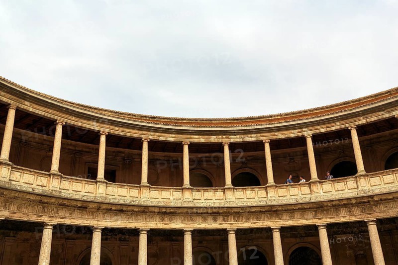 Palacio de Carlos V, Palace of Charles V, Renaissance palace in the Alhambra, tourists on a gallery with columns made of conglomerate stone, Granada, Andalusia, Spain