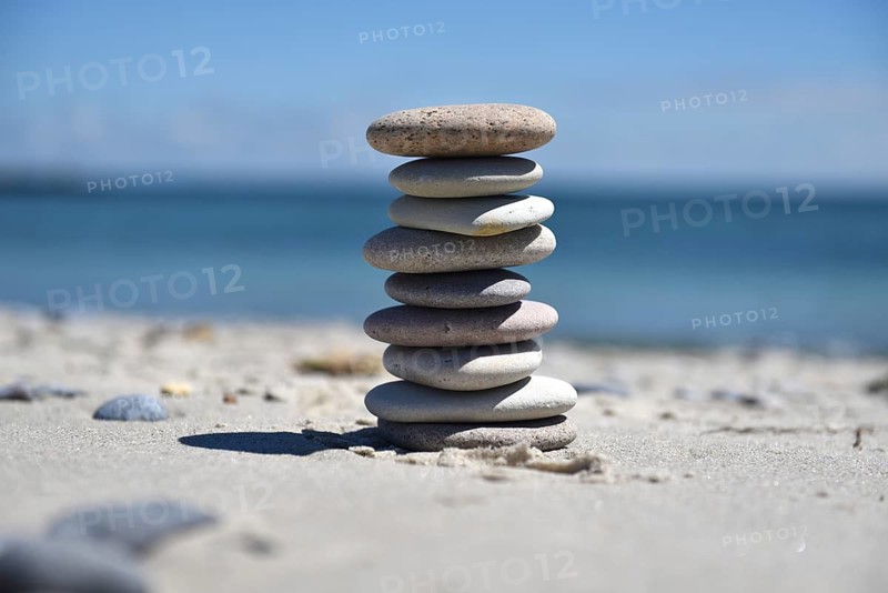 Stone pile on the sandy beach of the offshore island of Heligoland, Schleswig-Holstein, Germany