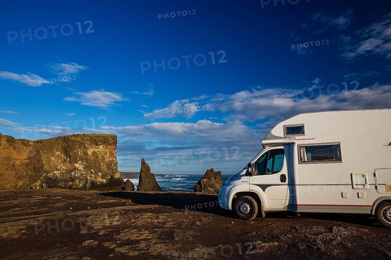Motorhome parking on the shoreline, south of Sandvik with crashing waves. Rough nature