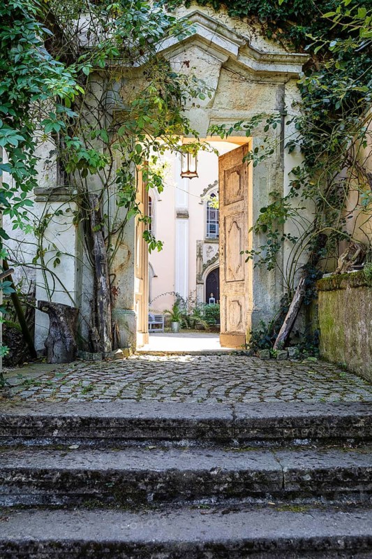 Wreathed passageway from the castle park into the castle courtyard, Püchau Castle, Machern, Saxony, Germany