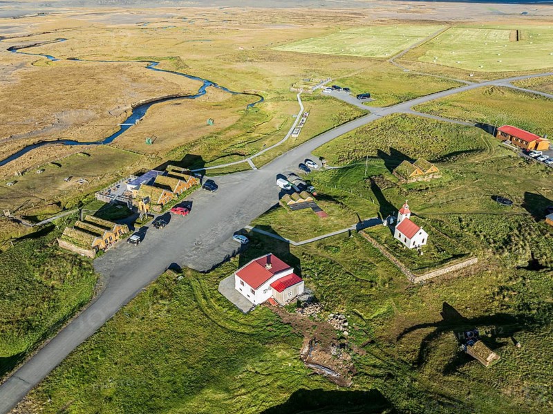 Mödrudalur farm and guesthouse northwest of Egilsstadir, aerial view of church, restaurant and campsite, Iceland