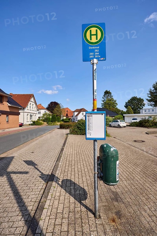 Bus stop Zetel Denkmal, residential building, blue sky, Dammstraße, Zetel, district of Friesland, Lower Saxony, Germany
