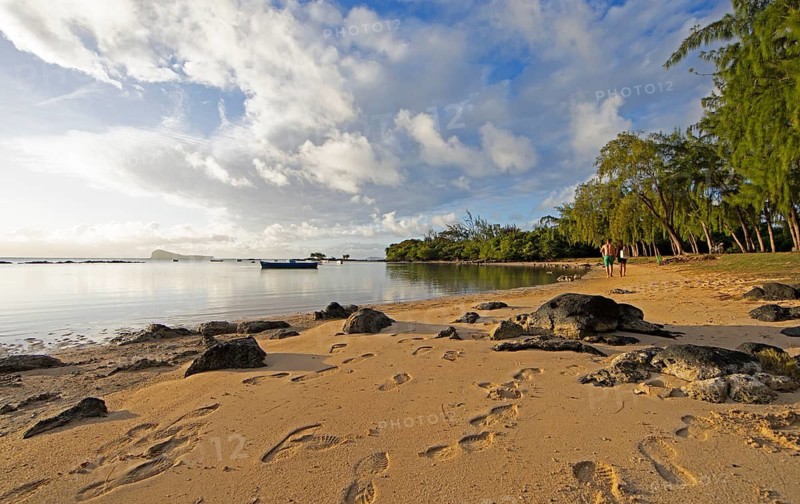Golden sandy beach on the Indian Ocean near Calodyne, with Gunner's Coin Island in the background, Riviere du Rempart district, Mauritius